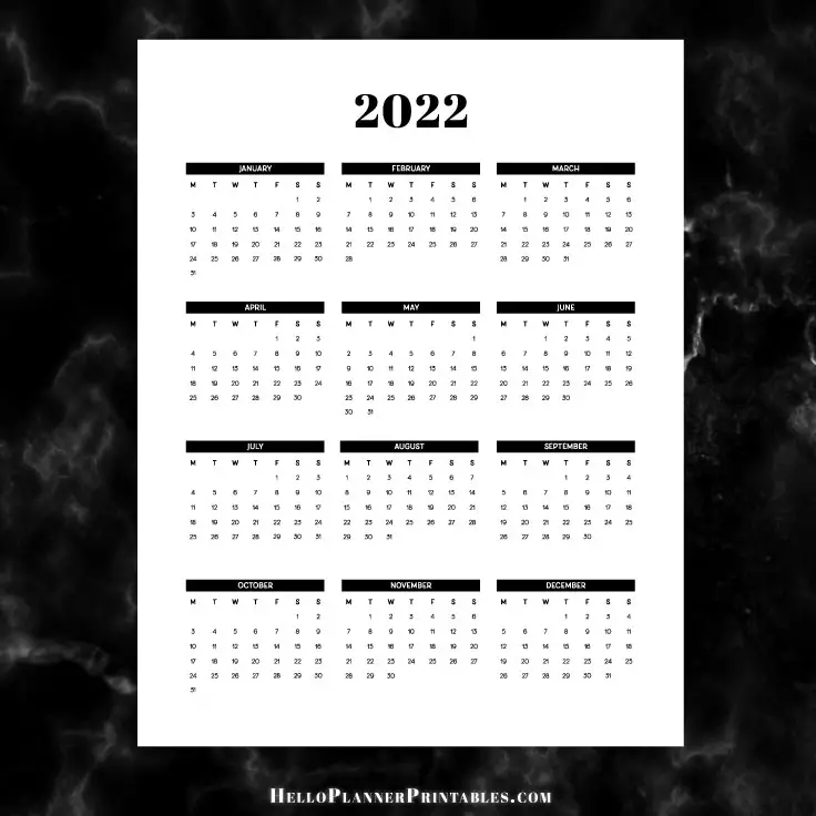Preview of 2022 year at a glance calendar printable on a black marble background.